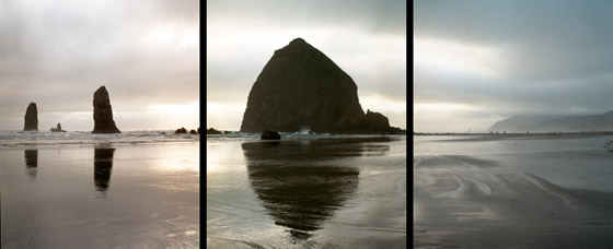 Mid summer evening view of Haystack Rock,  the Needles and beachcombers at Cannon Beach; location for the film: The Goonies