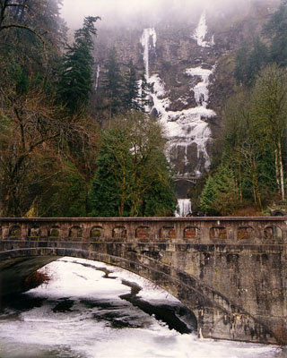 View of Multnomah Creek the Scenic Highway Bridge and Multnomah Falls with winter snow and ice