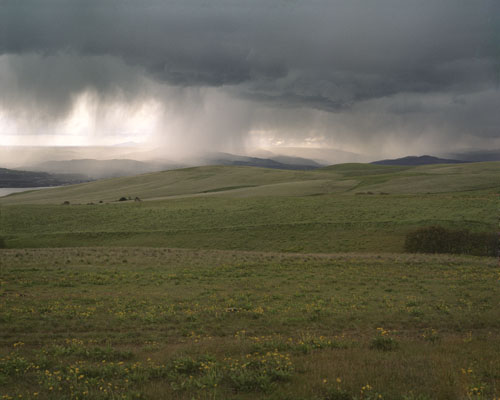 Standing on the north side of the Columbie River in Washington,  looking toward The Dalles,  Oregon and an approaching thunderstorm.  Half an hour later,  the deluge hit me.