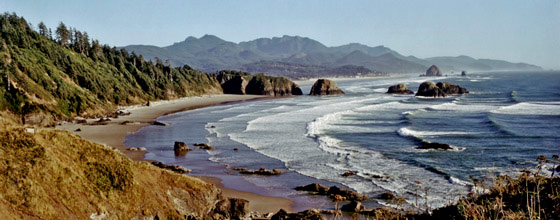 Afternoon surf at Ecola State Park,  looking down at Crescent Beach with the town of Cannon Beach and Haystack Rock as a backdrop. One of the iconic views of the Oregon coast.