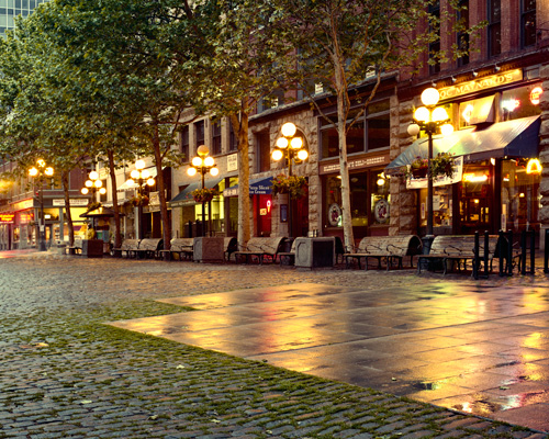 Early morning rain on Pioneer Square in Seattle,  Doc Maynard's,  the start of Pioneer Square's underground tour on the right