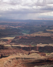 View of rain showers over the Colorado River Near Moab, Utah