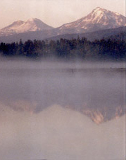 Broken Top, South Sister,  North Sister and Black Crater from a misty pond