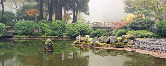 Koi pond and Moon Bridge on a foggy morning at the Portland Japanese Garden